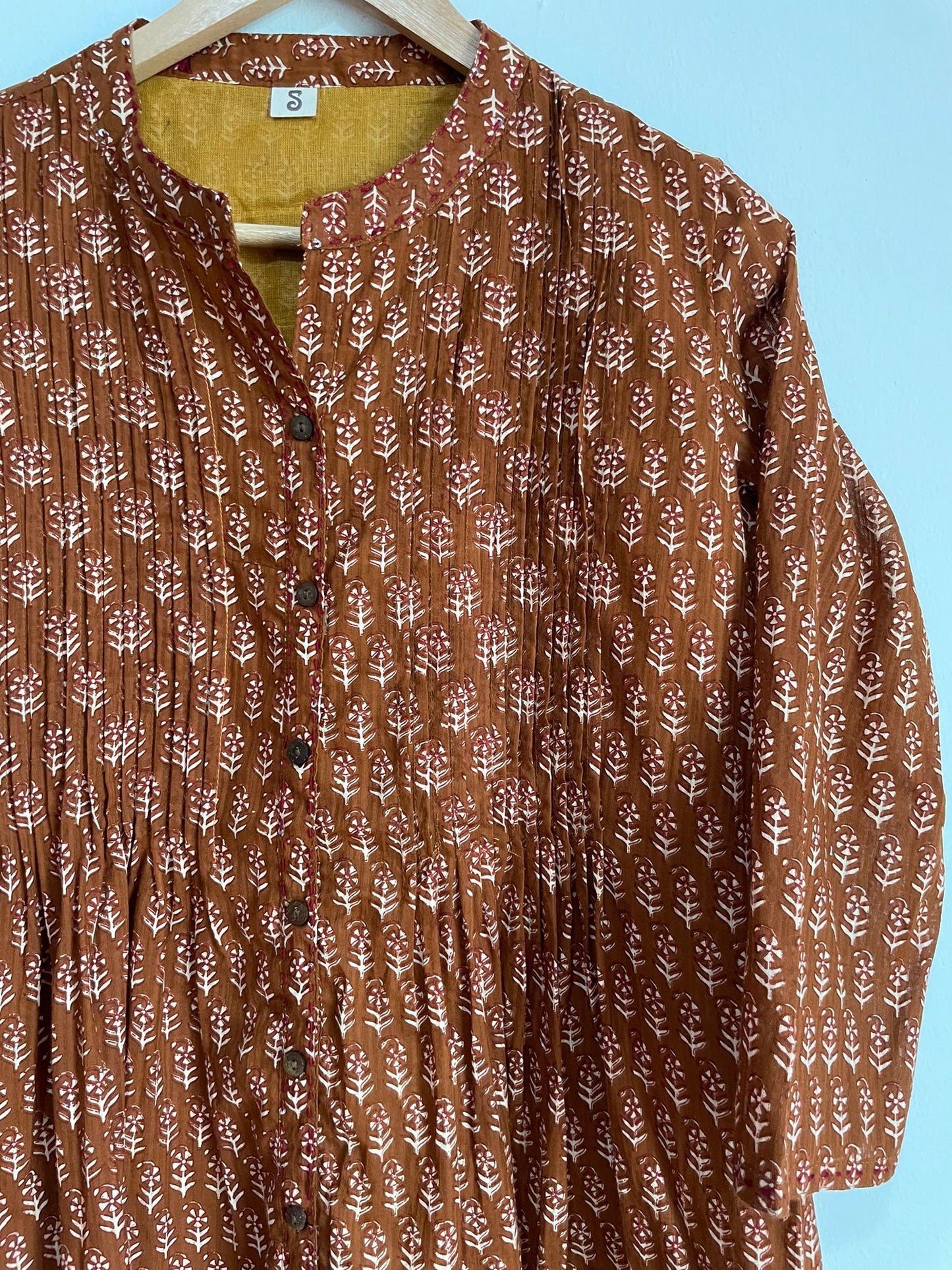 handmade cotton top, ideal for all occasions. Women can enjoy affordability and quality with this piece.