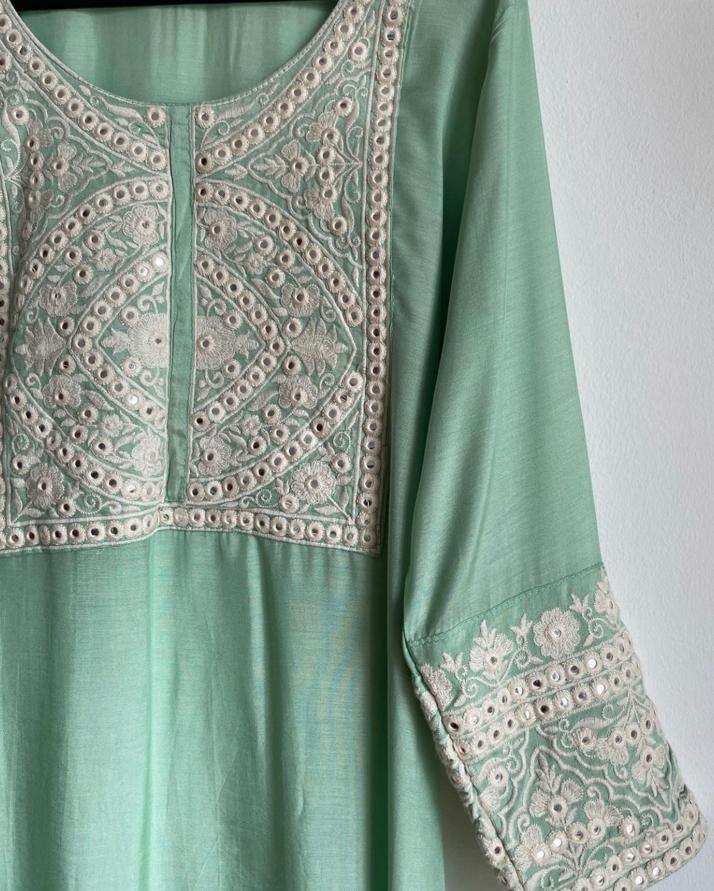 delicate Deepavali suit for women. High quality and affordable dress in green color