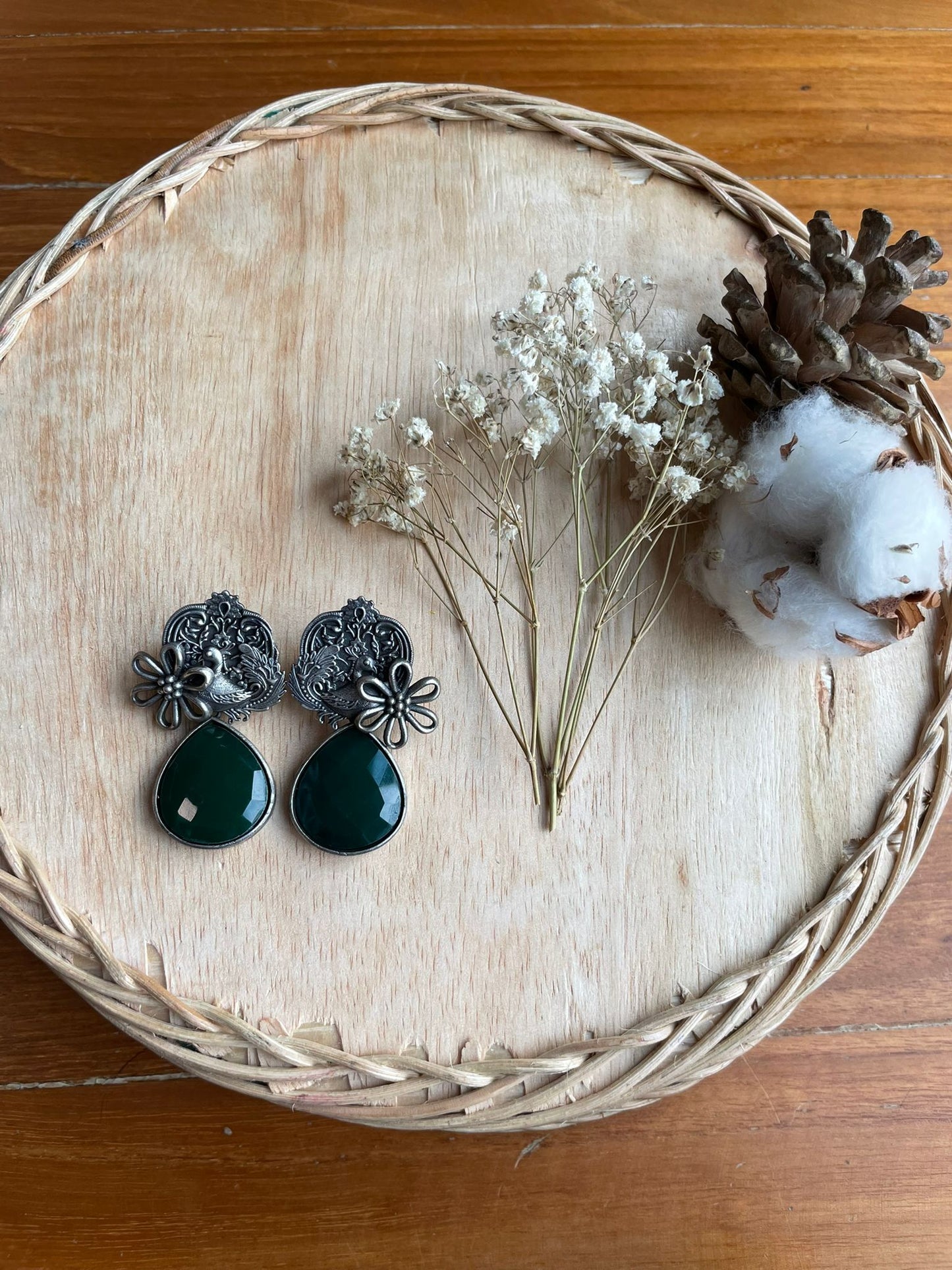green teardrop jhumka with floral and peacock